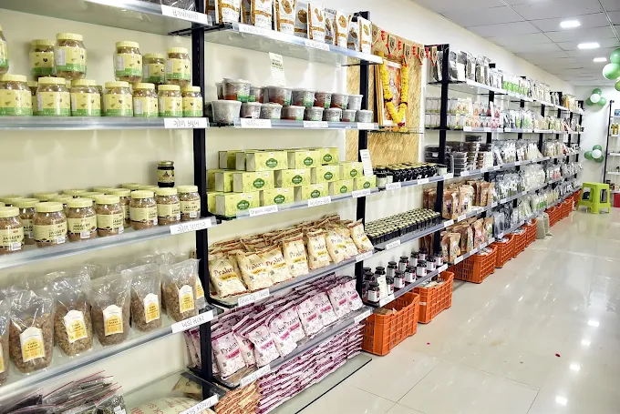 Organic products displayed on shelves inside the Rajkot store